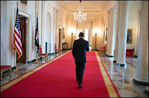 President Obama Walking in Cross Hall at the White House. (Official White House Photo by Pete Souza.)