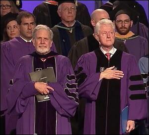 NYU President John Sexton (left); Bill Clinton (right) at the NYU Abu Dhabi Commencement Ceremony on May 25, 2014