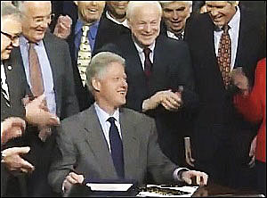 President Bill Clinton Laughs It Up as He Signs the Repeal of the Glass-Steagall Act, November 12, 1999
