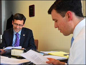 Washington State Attorney General Bob Ferguson (left) and Solicitor General Noah Purcell Read the Ninth Circuit Decision on February 9, 2017