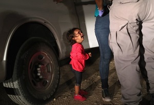 This Viral Photo by Pulitzer Prize Winning Photograher John Moore of Getty Images Captures the Trauma of a Two-Year Old Girl from Honduras at the U.S. Southern Border