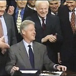 President Bill Clinton Laughs It Up as He Signs the Repeal of the Glass-Steagall Act, November 12, 1999
